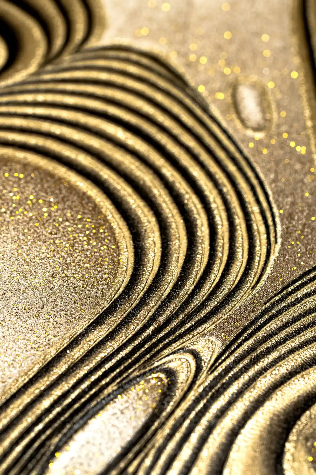 Extreme macro of golden glitter-coated swirling ridges on the bronze metallic wallpaper surface